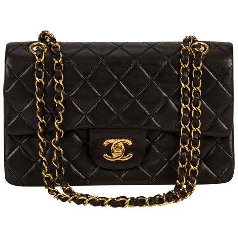 black and gold chanel handbag|Black Chanel bag gold chain.